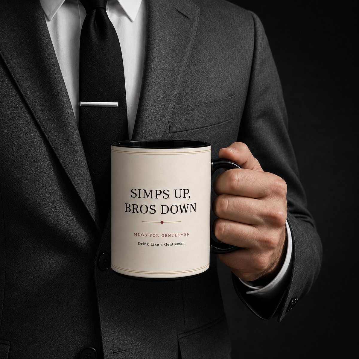 Man in a dark gray suit holding the Protocol No. 001 Black Issue mug, showing the Simps Up, Bros Down brand side.
