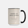 Ivory 15 oz ceramic coffee mug with black handle displaying the Simps Up, Bros Down brand mark.
